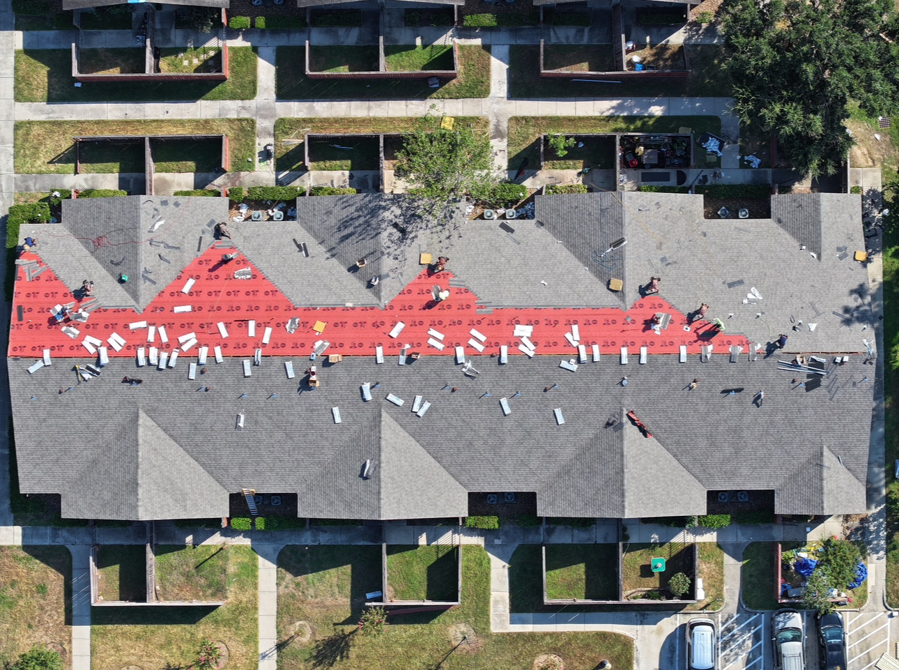Multi-family roof replacement with synthetic underlayment