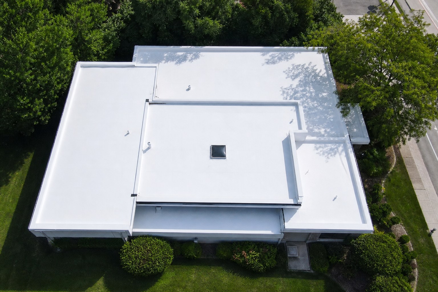 Aerial view of commercial flat roofing installation